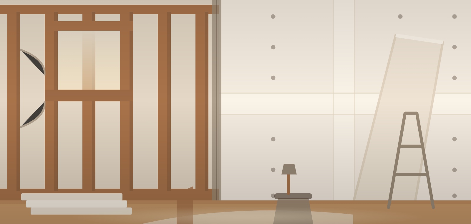 A room part way through drywall, with studs exposed on one wall and finished panels on the other